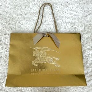 Burberry gold shopping paper gift bag with grey ribbon